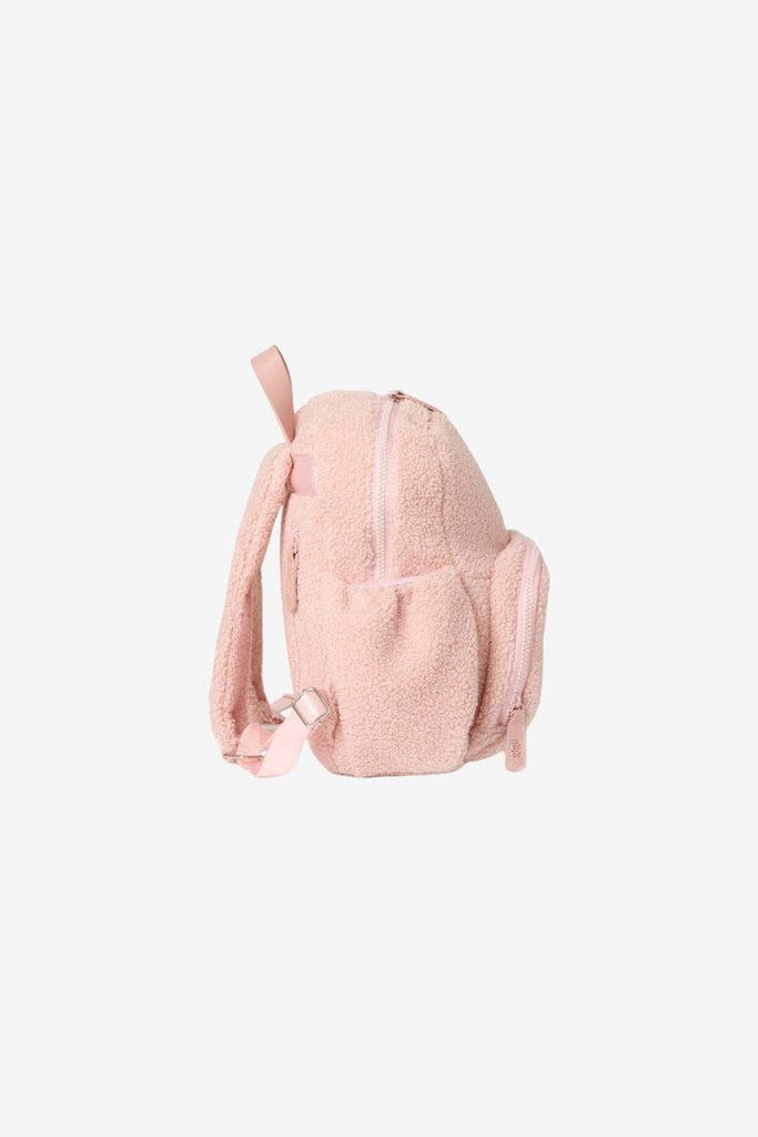 Side view of children's Ava blush pink teddy fleece backpack with water bottle pocket 