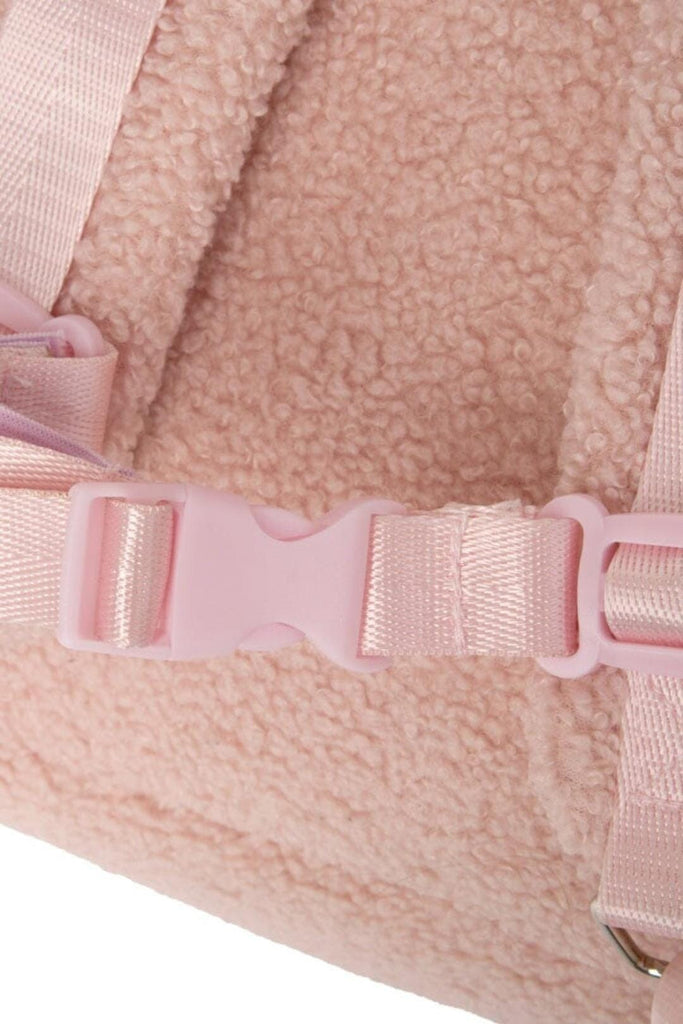 Sternum strap buckle on the Ava children's blush pink teddy backpack 