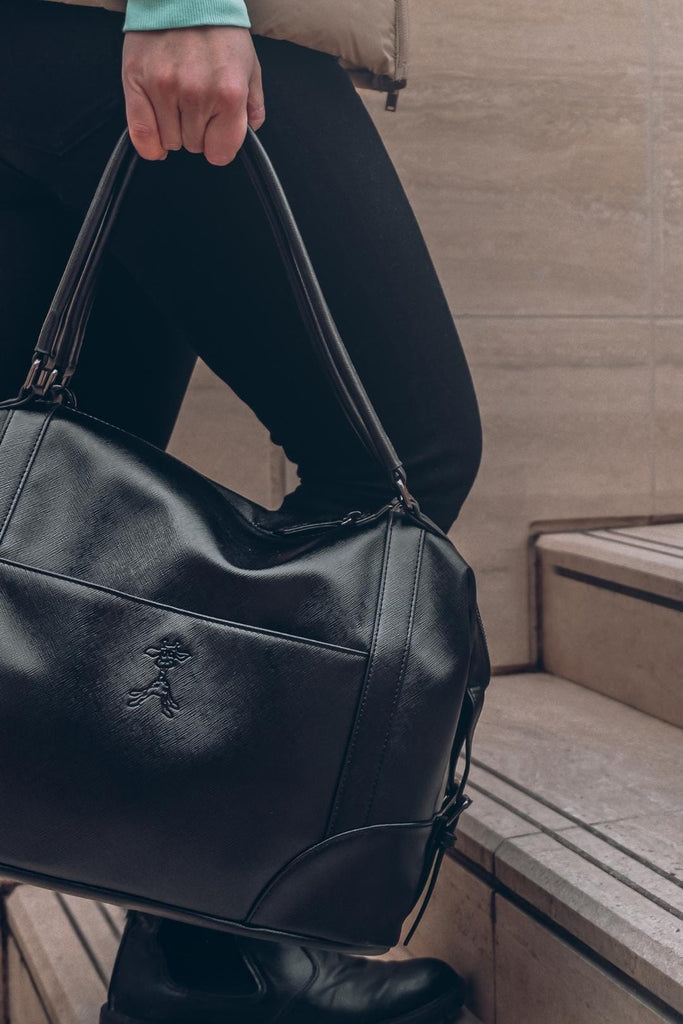 Black diaper bag with giraffe logo 