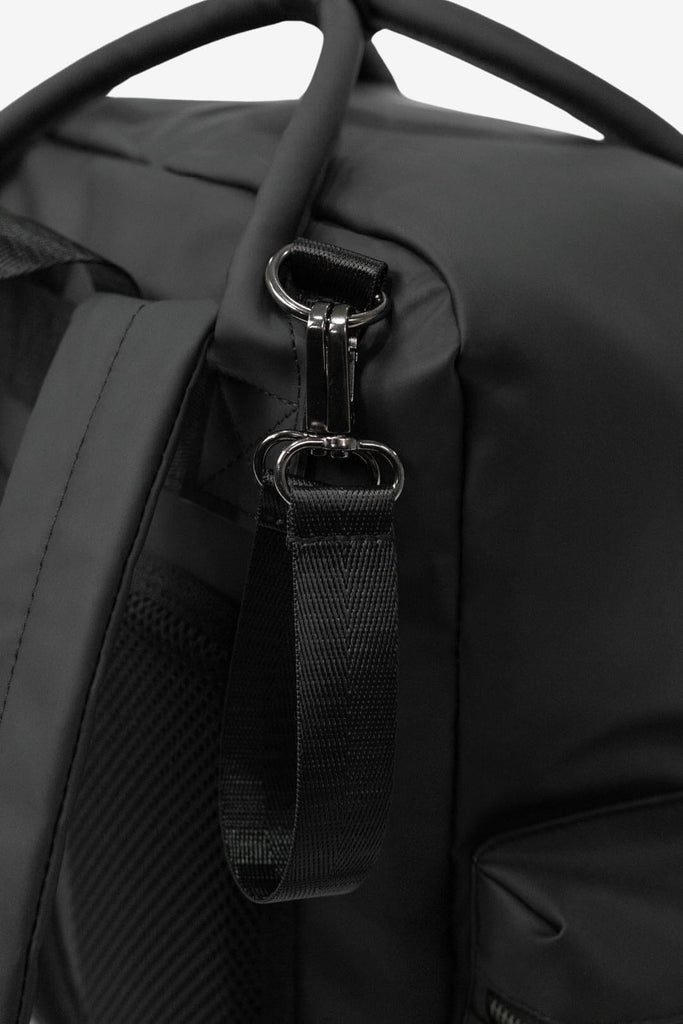 Close up image of the Coast - Black buggy/pram straps. 