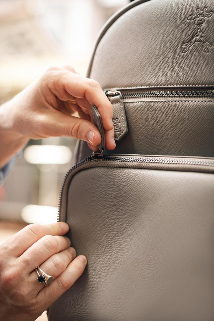 YKK zips on bloom grey vegan leather changing backpack 
