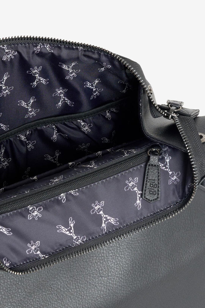 Interior of vegan leather diaper backpack with giraffe printed lining 