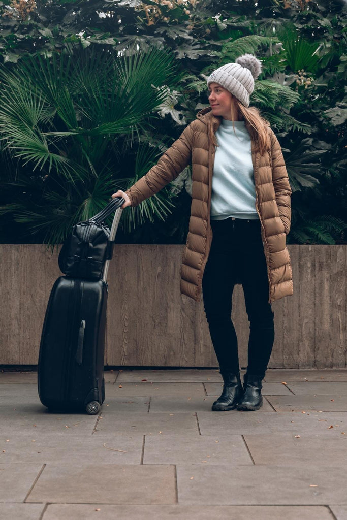 Vegan leather diaper bag with a trolley sleeve on a suitcase 