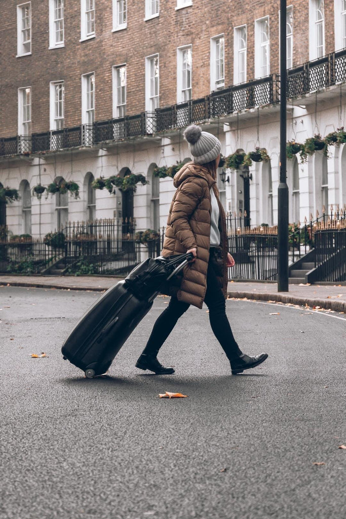 Black bambino changing bag on a suitcase