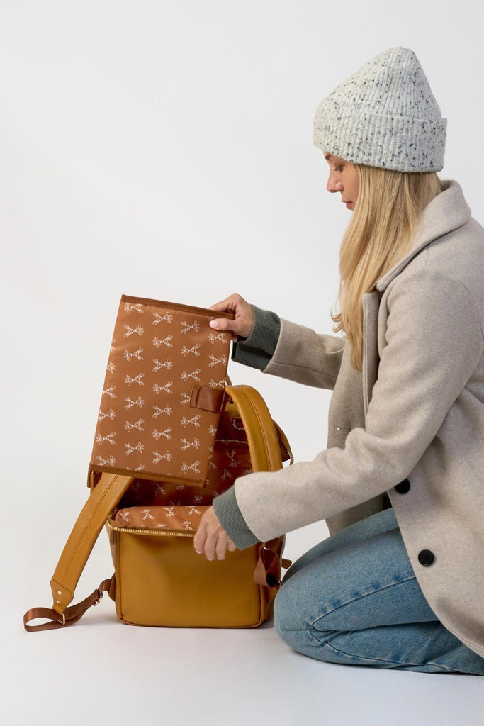 Vegan leather diaper backpack with matching tan changing mat 