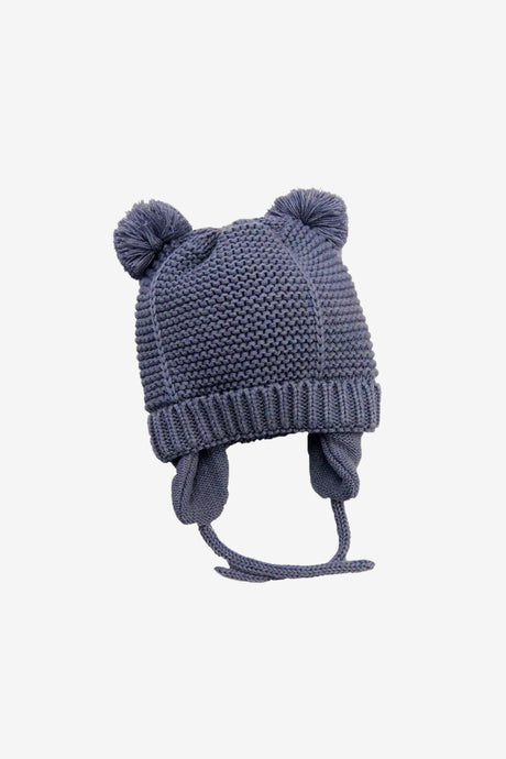 Navy knit baby bobble hat on white background