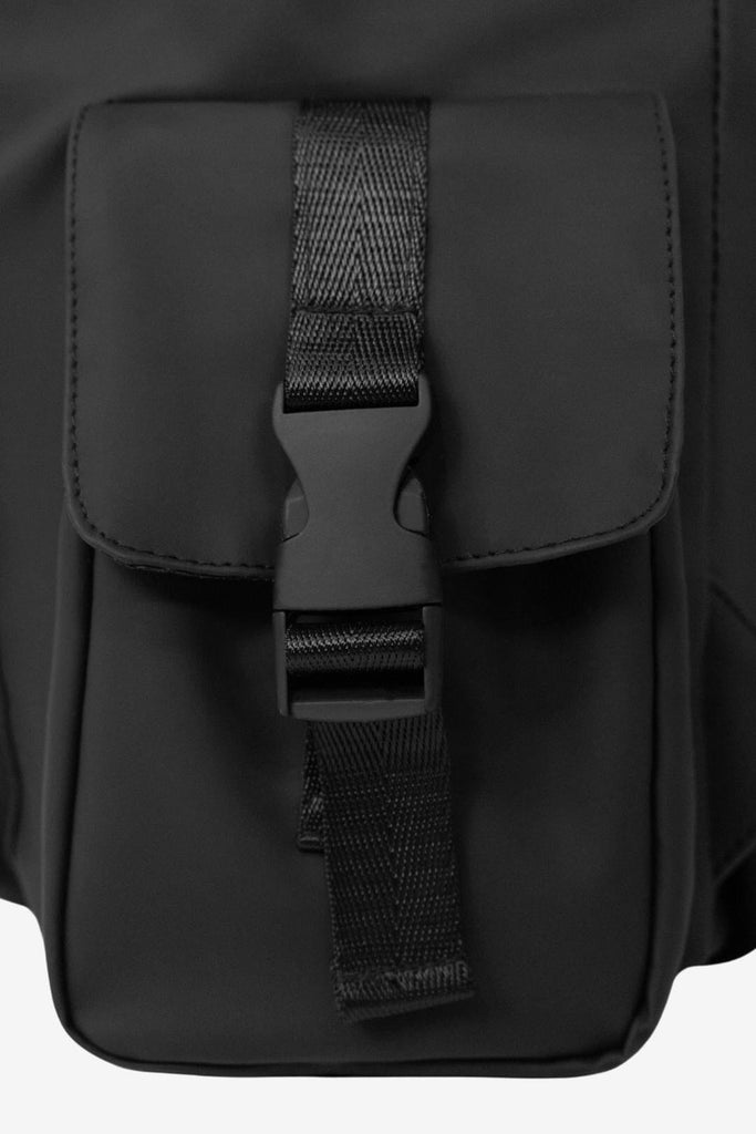 Close up image showing the insulated side pocket with the buckle/clip fastener on the Nova Changing Backpack.