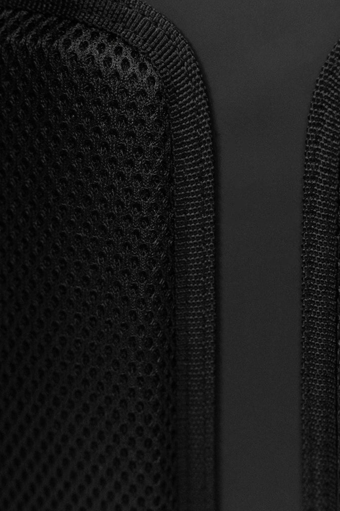 Close up image of the comfy breathable back pads on the Coast Backpack.