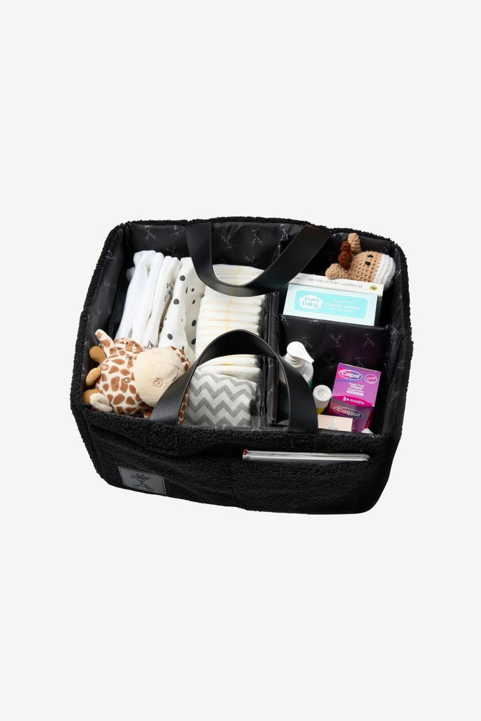 Top down view of organised black teddy nappy caddy with black vegan leather handles 