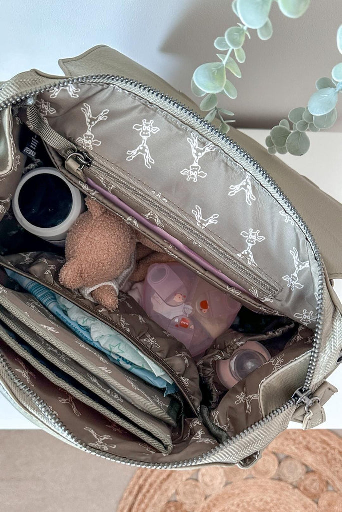 Vegan leather baby changing backpack with matching giraffe print interior lining