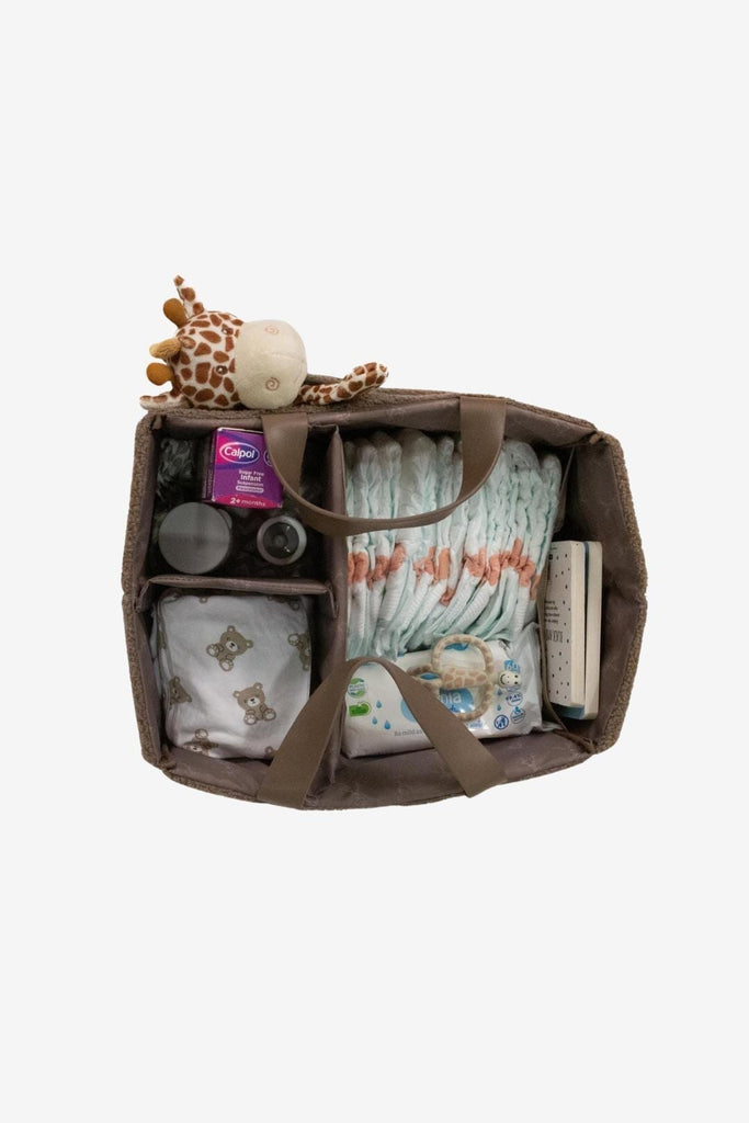 Top down view of organised brown teddy nappy caddy with vegan leather handles 