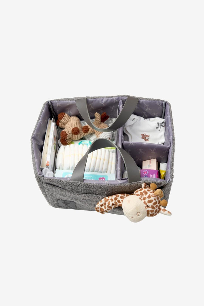 Grey teddy nappy caddy with vegan leather handles filled with baby essentials 