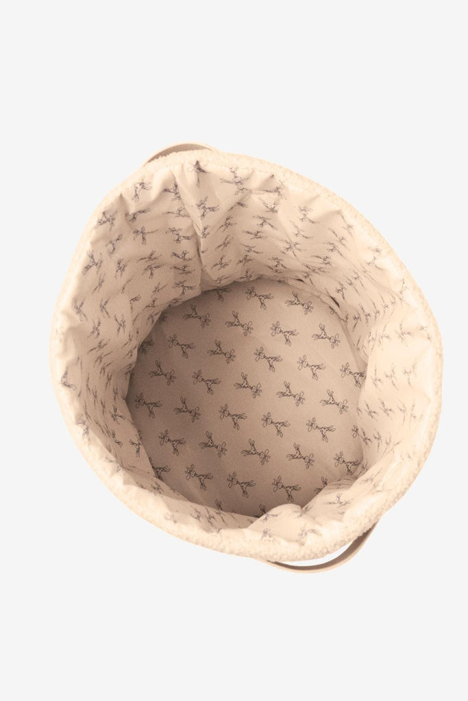 Top down view of storage basket with giraffe print lining